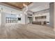 Open-concept living space featuring hardwood floors, high ceilings, and large windows with scenic views at 1194 N Peninsula, New Smyrna Beach, FL 32169