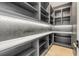 Organized pantry with custom shelving, countertop space, and stylish backsplash at 1194 N Peninsula, New Smyrna Beach, FL 32169