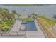 Breathtaking waterfront property with a modern pool, dock, and boat lift for ultimate relaxation and coastal living at 1194 N Peninsula, New Smyrna Beach, FL 32169