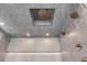 Shower with stylish tiling, ceiling mounted shower heads and modern fixtures at 1194 N Peninsula, New Smyrna Beach, FL 32169