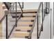 Modern staircase with wooden steps and glass railing at 1194 N Peninsula, New Smyrna Beach, FL 32169