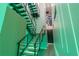Modern staircase featuring sleek design with unique lighting and contemporary railing at 1194 N Peninsula, New Smyrna Beach, FL 32169