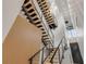 Unique staircase design with wood accent wall, floating steps, and a modern chandelier in view at 1194 N Peninsula, New Smyrna Beach, FL 32169