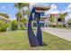 Unique mailbox stands in front of modern home featuring a sleek exterior design and manicured lawn at 1194 N Peninsula, New Smyrna Beach, FL 32169