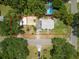 Aerial view of home with fenced lot, backyard, and driveway at 1208 Pat Ave, New Smyrna Beach, FL 32168