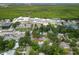 An aerial view of the neighborhood, with nearby mangrove wetlands in the background at 1208 Pat Ave, New Smyrna Beach, FL 32168