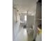 Bathroom featuring a shower with curtain, toilet and sink in a compact space with tile flooring at 1208 Pat Ave, New Smyrna Beach, FL 32168