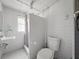 Bathroom featuring white walls, a shower, and toilet at 1208 Pat Ave, New Smyrna Beach, FL 32168