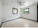Bedroom featuring white walls, floors, and ceiling fan at 1208 Pat Ave, New Smyrna Beach, FL 32168