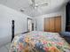 Bedroom featuring white walls, tile floors, and ceiling fan at 1208 Pat Ave, New Smyrna Beach, FL 32168