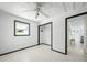 Bedroom featuring white walls, floors, and ceiling fan at 1208 Pat Ave, New Smyrna Beach, FL 32168