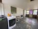 Laundry room with modern washer and dryer, plus sunroom access at 1208 Pat Ave, New Smyrna Beach, FL 32168