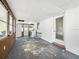 Living room featuring white walls, a washing machine and chairs at 1208 Pat Ave, New Smyrna Beach, FL 32168