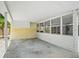 A large covered patio outside the rear of the house at 1208 Pat Ave, New Smyrna Beach, FL 32168