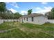 Well-maintained backyard with a white fence, green grass, and inviting outdoor space at 1290 9Th St, Orange City, FL 32763