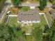 Aerial view of a backyard featuring a well-maintained lawn and white fence for privacy at 1290 9Th St, Orange City, FL 32763