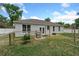 Lush backyard with a grill, seating area, and garden space, perfect for entertaining at 1290 9Th St, Orange City, FL 32763
