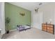 The room features a green accent wall and plenty of space for furniture at 1290 9Th St, Orange City, FL 32763