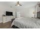 This primary bedroom features wood floors, neutral paint, and a white wood dresser at 1290 9Th St, Orange City, FL 32763