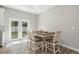 Cozy dining area with French doors, views of the backyard, and a neutral color palette at 1290 9Th St, Orange City, FL 32763