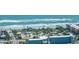 Beautiful aerial view of the beach, playground, and hotel on a sunny day at 135 Cedar Dunes Dr, New Smyrna Beach, FL 32169