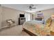 Comfortable bedroom with beachy decor, ceiling fan, and lots of natural light at 135 Cedar Dunes Dr, New Smyrna Beach, FL 32169