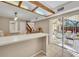Open dining area adjacent to the kitchen, with sliding doors leading to an outdoor patio at 135 Cedar Dunes Dr, New Smyrna Beach, FL 32169