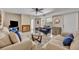 Living room featuring tile floors, comfortable sofas, fireplace, and neutral colors to make it bright at 135 Cedar Dunes Dr, New Smyrna Beach, FL 32169