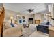 Cozy living room features comfortable seating, a fireplace, and neutral decor, creating an inviting space at 135 Cedar Dunes Dr, New Smyrna Beach, FL 32169