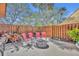 Private fenced patio with seating area and fire pit, perfect for enjoying outdoor relaxation and gatherings at 135 Cedar Dunes Dr, New Smyrna Beach, FL 32169