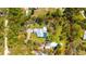 Expansive property with lush landscaping, pool, and outbuildings offers privacy and space to roam at 1370 Jane Lacey Ln, New Smyrna Beach, FL 32168