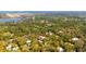 Aerial view of a property bordered by trees and nearby waterways, highlighting its desirable natural surroundings at 1370 Jane Lacey Ln, New Smyrna Beach, FL 32168