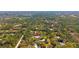 Overhead view of the property nestled in a verdant, tree-filled landscape, highlighting its secluded and natural setting at 1370 Jane Lacey Ln, New Smyrna Beach, FL 32168