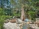 Backyard patio with a fire pit, lounge chairs, and comfortable seating offers a relaxing outdoor experience at 1370 Jane Lacey Ln, New Smyrna Beach, FL 32168