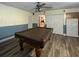 Spacious basement with a pool table, closet, and cabinet provides ample recreational opportunities at 1370 Jane Lacey Ln, New Smyrna Beach, FL 32168