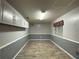 Finished basement area with gray walls and wood-look flooring at 1370 Jane Lacey Ln, New Smyrna Beach, FL 32168