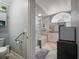 Bathroom featuring step-in shower, jacuzzi tub, vanity and ample lighting at 1370 Jane Lacey Ln, New Smyrna Beach, FL 32168