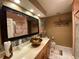 Bathroom featuring tile flooring, a vessel sink, large mirror and a decorative glass shower at 1370 Jane Lacey Ln, New Smyrna Beach, FL 32168