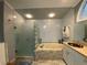 Bathroom featuring a soaking tub, shower, and vanity at 1370 Jane Lacey Ln, New Smyrna Beach, FL 32168