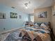 Inviting bedroom features a ceiling fan, and a comfortable bed with a colorful quilt at 1370 Jane Lacey Ln, New Smyrna Beach, FL 32168
