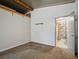 Bedroom with neutral carpet and a door leading to the bathroom, ample natural light at 1370 Jane Lacey Ln, New Smyrna Beach, FL 32168