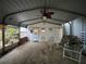 Covered carport with seating, offering shade and protection for vehicles and relaxation at 1370 Jane Lacey Ln, New Smyrna Beach, FL 32168
