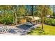 Covered carport provides shelter for your vehicle and equipment, surrounded by lush greenery at 1370 Jane Lacey Ln, New Smyrna Beach, FL 32168