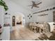 Open dining area with archways, white table set, and tile flooring at 1370 Jane Lacey Ln, New Smyrna Beach, FL 32168
