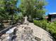 Cozy backyard fire pit area with surrounding benches, ideal for entertaining friends and Gathering in a serene outdoor setting at 1370 Jane Lacey Ln, New Smyrna Beach, FL 32168