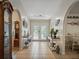 Spacious foyer with tiled floor, stylish decor, arched doorways and double front doors at 1370 Jane Lacey Ln, New Smyrna Beach, FL 32168