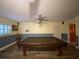 Finished basement featuring a pool table and ceiling fan at 1370 Jane Lacey Ln, New Smyrna Beach, FL 32168