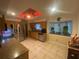 Bright kitchen features stainless appliances, wooden cabinets, a tiled floor, and a large window at 1370 Jane Lacey Ln, New Smyrna Beach, FL 32168