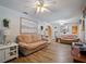 Cozy living room featuring wood floors, neutral tones, and two comfortable sofas at 1370 Jane Lacey Ln, New Smyrna Beach, FL 32168