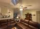 Spacious living room with leather furniture, offering an inviting space for relaxation and gatherings at 1370 Jane Lacey Ln, New Smyrna Beach, FL 32168